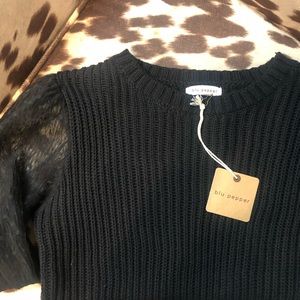 Texas boutique sweater with lace sleeves. New. Size medium